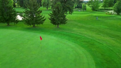 Drone shot of golf flag on beautiful green course in Canada