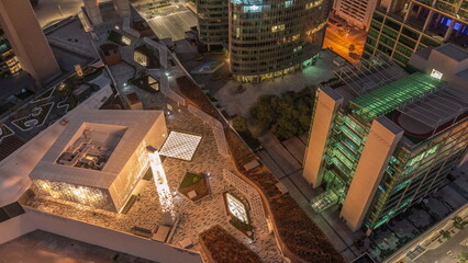 Dubai international financial center skyscrapers aerial night to day timelapse.