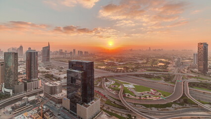 Naklejka na ściany i meble Sunrise over highway junction near media city and al barsha heights district area timelapse from Dubai marina.