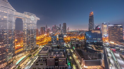 Obraz premium Futuristic Dubai Downtown and finansial district skyline aerial night to day timelapse.