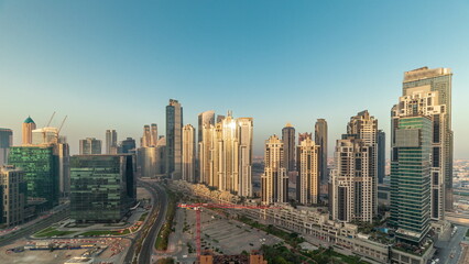Bay Avenue during sunrise with modern towers in Business Bay aerial panoramic timelapse, Dubai