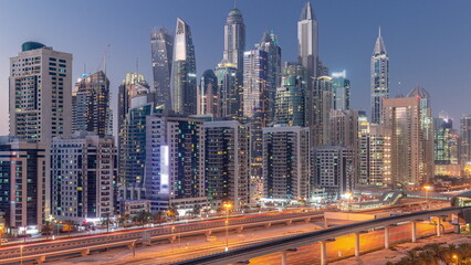 Naklejka na ściany i meble Dubai marina tallest block of skyscrapers day to night timelapse.