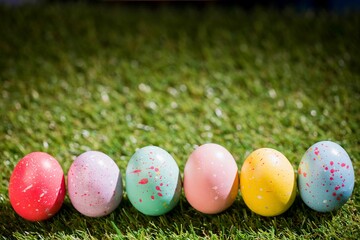 Fototapeta na wymiar Easter eggs on grass in garden
