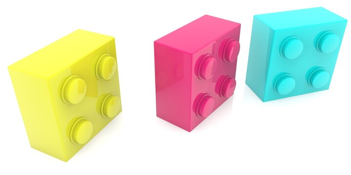 Yellow, red and blue toy bricks next to each other