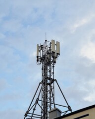 Technology on the top of the telecommunication GSM (5G,4G) tower with copy space.Cellular phone antennas on a building roof.Telecommunication mast television antennas.Development communication system