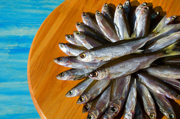 Dried dried fish bleak on a wooden board.