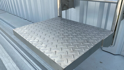 Checker plate abstract floor metal stainless  steel texture background with reflection light. 