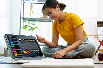 Portrait of an Asian woman designing art in her spare time.