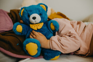 Cute child sleeping with teddy bear