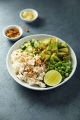 Homemade chicken bowl with rice and avocado
