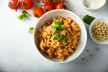 Homemade chicken ragout with pine nuts