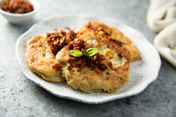 Homemade potato pancakes with red pesto