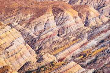 Layered colorful mountains at tectonic fault in Vashlovani desert, Georgia.