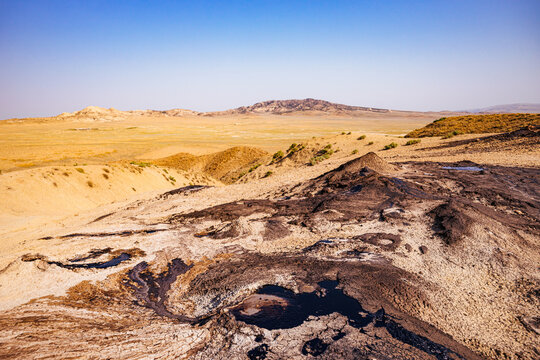 Geysers at Takhti-Tepha erupting mud and crude oil. Vashlovani desert, Georgia.