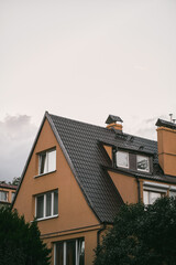House on cloudy sky background in the evening.