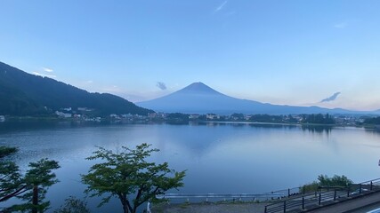 Magnificent Japanese traditional view, Mt Fuji at just after 5:30 am, the beautiful silhouette revealed in whole after cloudy evening the day before.  Photo taken year 2022 August 27th