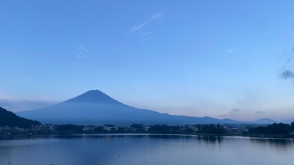 Fototapeta premium 5:30am, the clear view of the Mt. Fuji, the world heritage of Japan. Beautiful morning light at the lakeside of Kawaguchiko, Yamanashi prefecture. Return to the hometown year 2022 August 27th