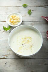 Traditional homemade cheese soup with croutons