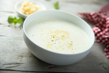 Obraz na płótnie Canvas Traditional homemade cheese soup with croutons