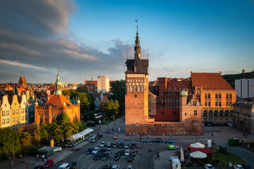 Naklejka na ściany i meble Beautiful architecture of the Main Town of Gdansk in the rays of the setting sun. Poland