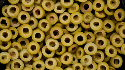 Sliced green olives top view. Cut green olives for salad