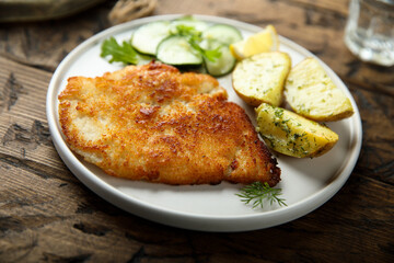 Traditional homemade schnitzel with potatoes