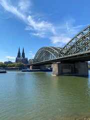 view of Hohenzollern Bridge over the river Rhine in Cologne. It is a most heavily used railway bridge in Germany accessible for pedestrians