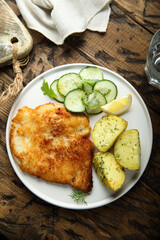 Traditional homemade schnitzel with potatoes