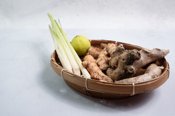 selective focus on spices such as ginger, turmeric, lime, and lemongrass, commonly used for natural herbal remedies for coughs and maintaining stamina