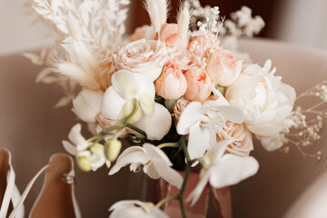 The bride's wedding bouquet of roses and orchids