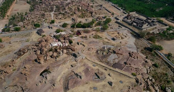 Aerial shot of rocky bouldery landscape with temple ruins all around