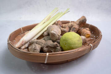 selective focus on spices such as ginger, turmeric, lime, and lemongrass, commonly used for natural herbal remedies for coughs and maintaining stamina