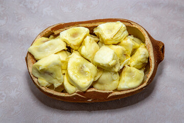 Ripe cupuaçu fruit (Theobroma grandiflorum) opened showing the seeds and the husk of the fruit. In fine details