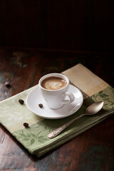 Cup of coffee on dark wooden background. Copy space. 
