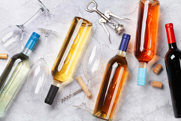 Various wine bottles and corkscrews