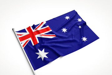 Australian Flag is Laying on a White Surface