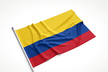 Colombian Flag is Laying on a White Surface
