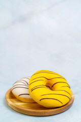 Assortment of donuts on marble table background. Close up. Top view.