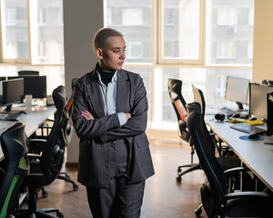 Fototapeta na wymiar Business woman with short haircut in empty office. 