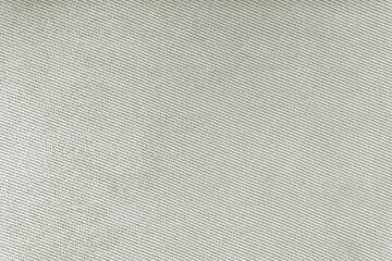 Texture of natural gray fabric or cloth. Fabric texture diagonal weave of natural cotton or linen textile material. Gray canvas background. Decorative fabric for curtain, furniture, walls, clothes