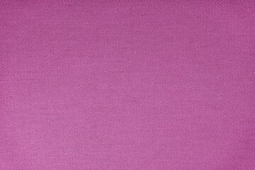 Texture of natural purple fabric or cloth. Fabric texture diagonal weave of natural cotton or linen textile material. Purple canvas background. Decorative fabric for curtain, furniture, walls, clothes