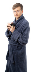 portrait of a man in a gray terry bathrobe. happy, healthy Man holds a mug of water. drinking more water is good for your health. better at home, stay home. quarantine. isolated.