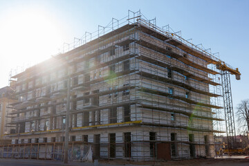 Insulation of the exterior walls of a building under construction.