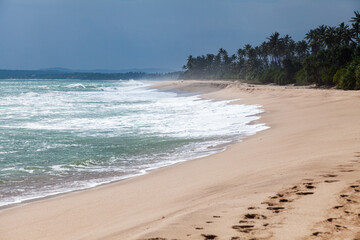 Restless waves on the shores of the Indian Ocean. Tangalle