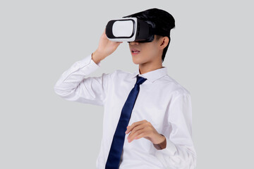 Experience of young asian businessman wearing VR Headset with excited isolated on white background, metaverse or virtual reality tech, innovation of futuristic, business and technology concept.