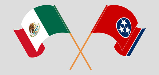 Crossed and waving flags of Mexico and The State of Tennessee