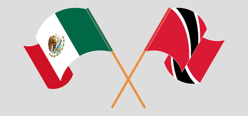 Crossed and waving flags of Mexico and Trinidad and Tobago