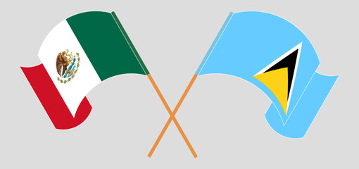 Crossed and waving flags of Mexico and Saint Lucia