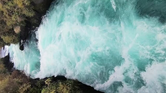 river rapids at huka falls near taupo or rotorua north island new zealand, landscape with water, rocks and trees. High quality photo