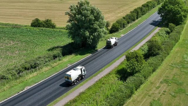 Road Sweepers Preparing a Street for Resurfacing